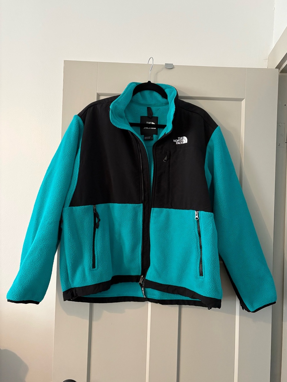 The North Face women’s Turquoise and Black Fleece Jacket